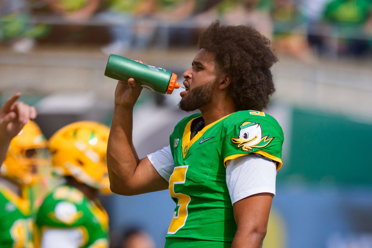 Oregon quarterback Dante Moore drinks water as the Oregon Ducks host the Boise State Broncos on Sept. 5, 2026, at Autzen Stadium in Eugene, Oregon.