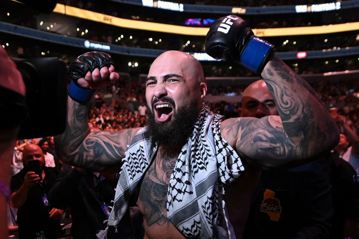 Sep 19, 2026; Los Angeles, California, USA; Sean Sharaf (blue gloves) reacts after defeating Gable Steveson (not pictured) during UFC 331 at Crypto.com Arena. Mandatory Credit: Griffin Hooper-Imagn Images