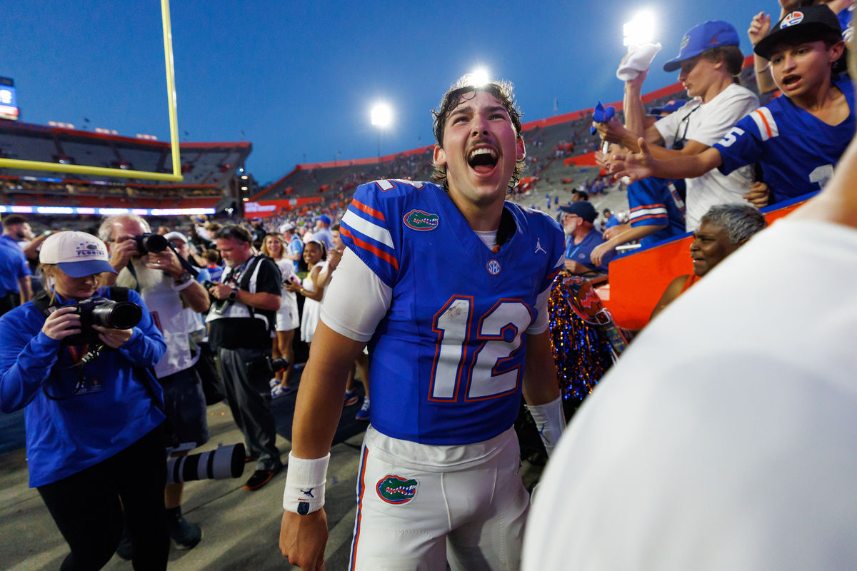 Sep 26, 2026; Gainesville, Florida, USA; Florida Gators quarterback Aaron Philo (12) celebrates while going to the locker room after a game against the Mississippi Rebels at Ben Hill Griffin Stadium. Mandatory Credit: Matt Pendleton-Imagn Images