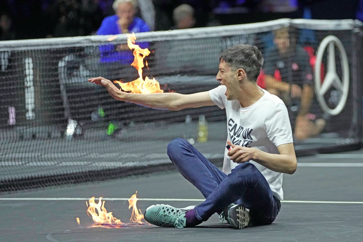 Climate change activist lights self, tennis court on fire during Laver Cup