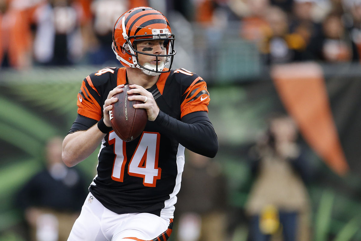 Cincinnati Bengals quarterback Andy Dalton rolls out of the pocket to throw a pass in the first quarter against the Pittsburgh Steelers on Dec. 13, 2015 at Paul Brown Stadium.