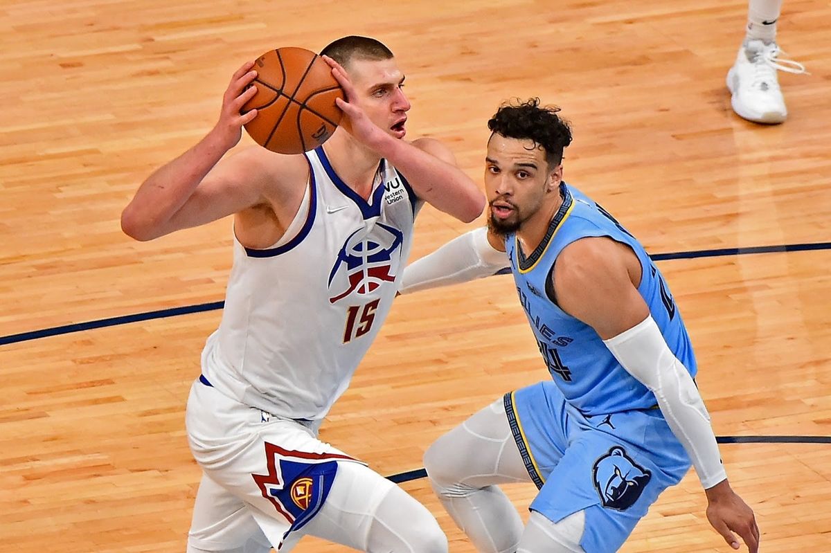 Nikola Jokić is peeking back at other MVP candidates and smiling like Usain Bolt in Rio