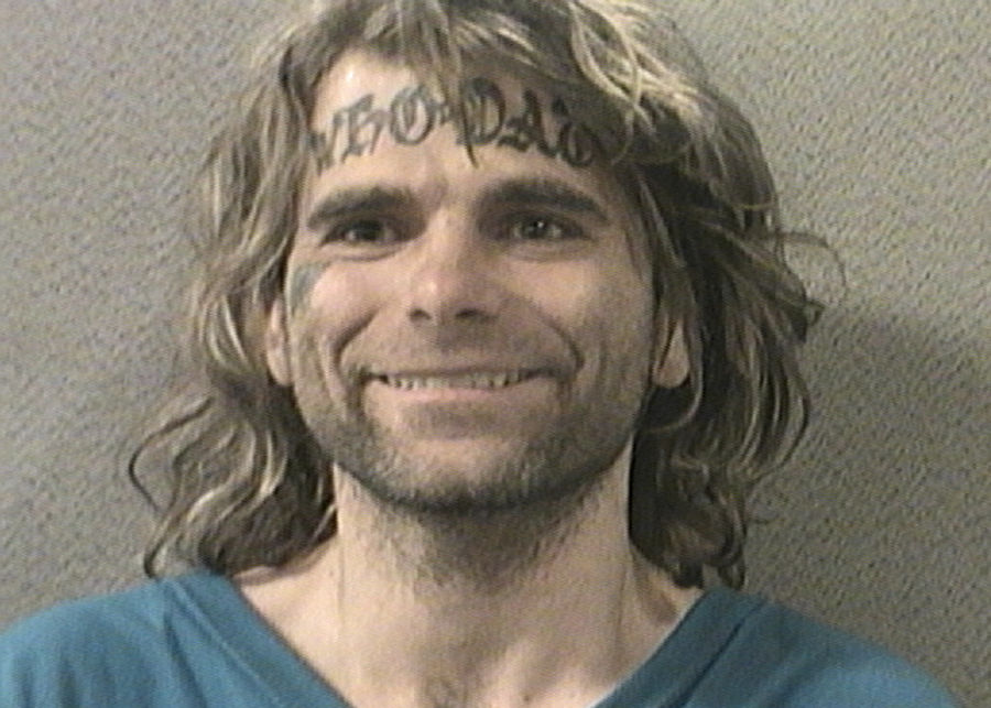 Man With "Who Dat" Forehead Tattoo Accused Of Grabbing Officers' Balls