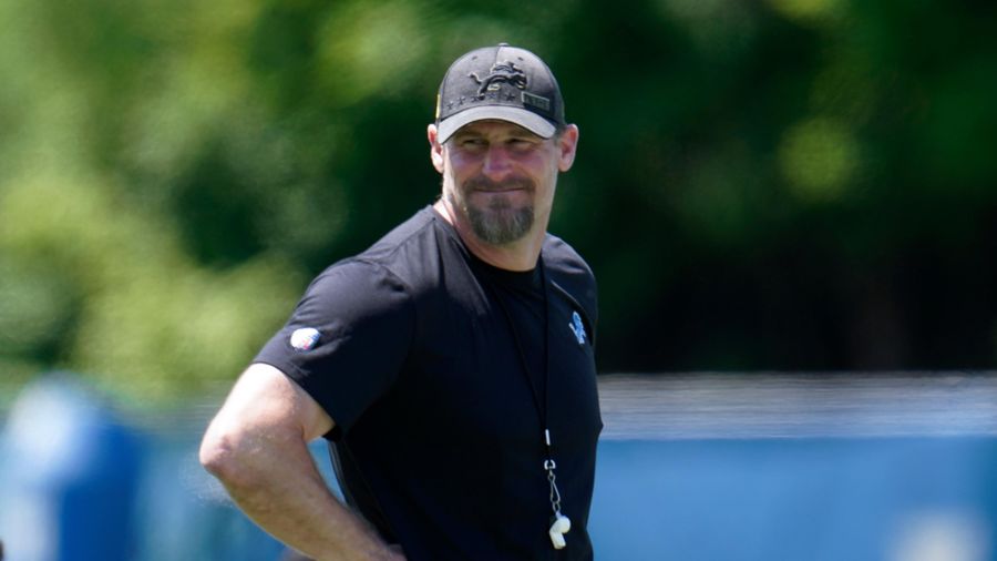Lions coach bizarrely dons helmet — probably to minimize damage from banging his head against the wall