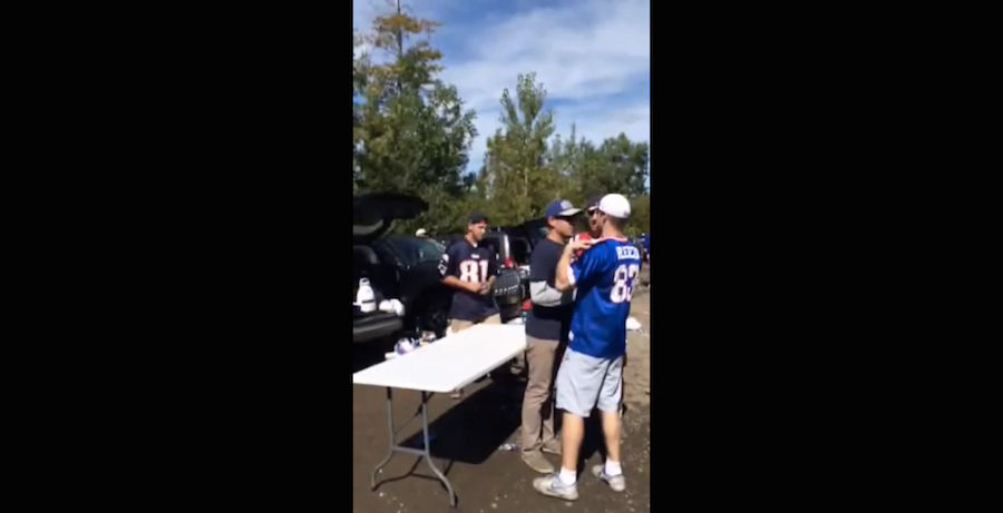 Bills Fan Uses Teamwork To Slam Patriots Fan Through Table