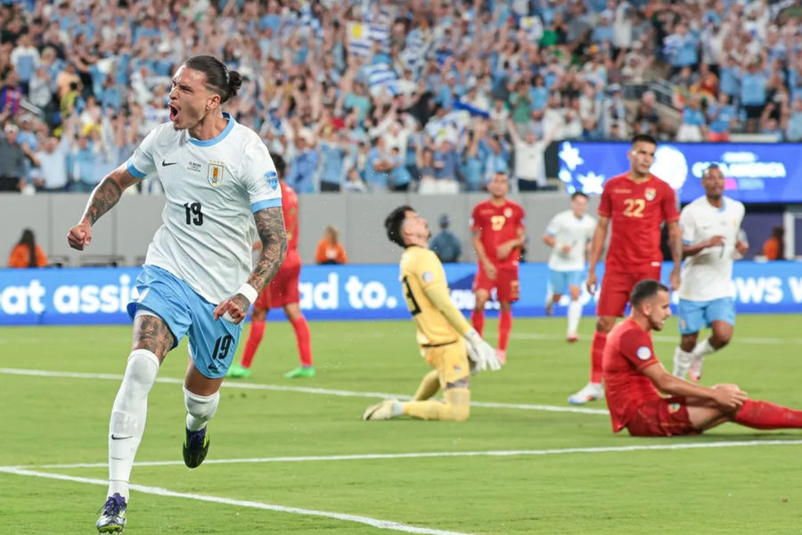 Jun 27, 2024; East Rutherford, NJ, USA; Uruguay forward Darwin Nunez (19) celebrates his goal past Bolivia goalkeeper Guillermo Viscarra (23) during the first half of the Copa America match at MetLife Stadium. Mandatory Credit: Vincent Carchietta-USA TODAY Sports