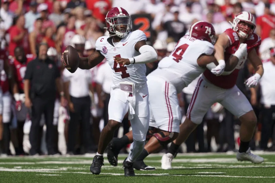 Sep 14, 2024; Madison, Wisconsin, USA; Alabama Crimson Tide quarterback Jalen Milroe (4) throws a pass during the first quarter against the Wisconsin Badgers at Camp Randall Stadium. Mandatory Credit: Jeff Hanisch-Imagn Images