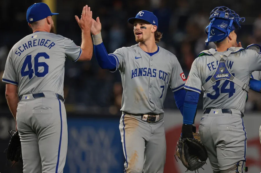 Sep 10, 2024; Bronx, New York, USA; Kansas City Royals shortstop Bobby Witt Jr. (7) and relief pitcher John Schreiber (46) celebrate after defeating the New York Yankees at Yankee Stadium. Mandatory Credit: Vincent Carchietta-Imagn Images