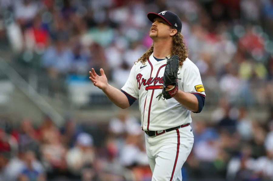 Sep 30, 2024; Atlanta, Georgia, USA; Atlanta Braves starting pitcher Grant Holmes (66) reacts after an inning against the New York Mets in the fourth inning at Truist Park. Mandatory Credit: Brett Davis-Imagn Images