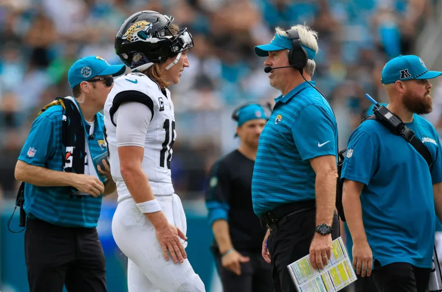 Jacksonville Jaguars quarterback Trevor Lawrence (16) talks with head coach Doug Pederson during the fourth quarter of an NFL <a href=