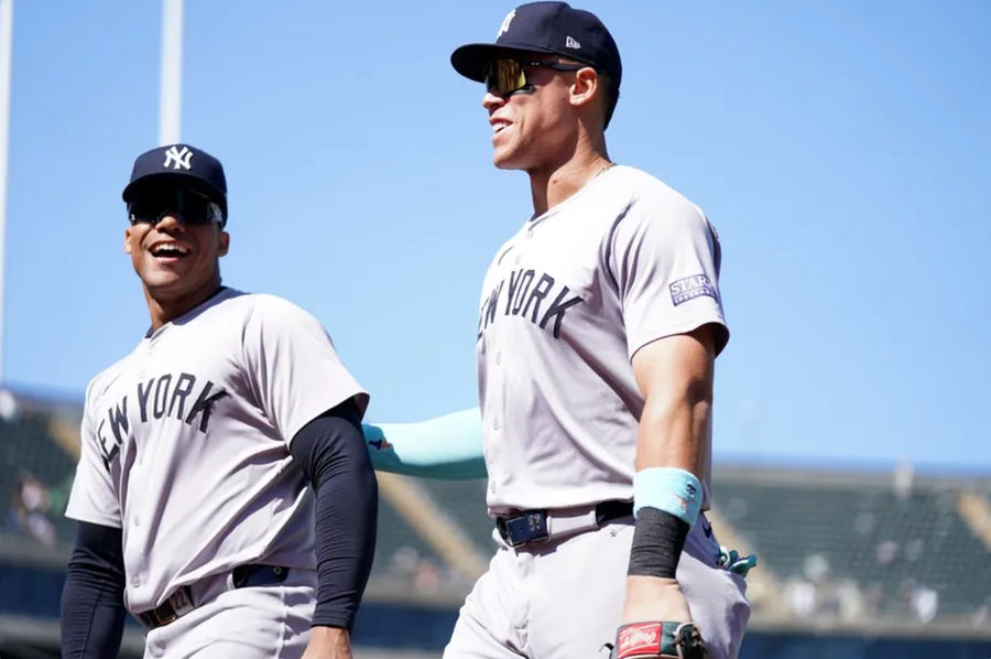 New York Yankees center fielder Aaron Judge (99) and right fielder Juan Soto (22) walk towards the dugout before the start of the fourth inning against the Oakland Athletics at the Oakland-Alameda County Coliseum. Mandatory Credit: Cary Edmondson-Imagn Images