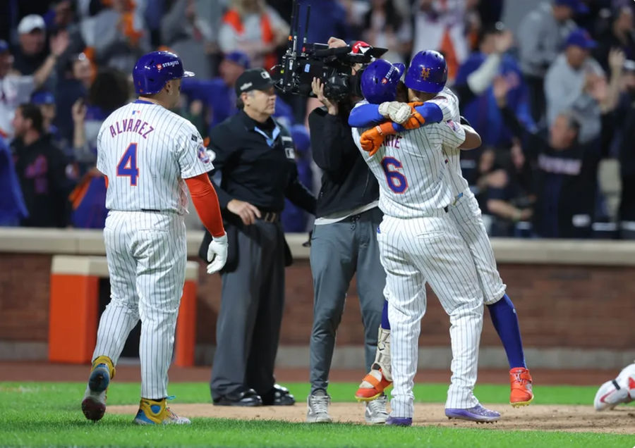 Oct 9, 2024; New York, New York, USA; New York Mets shortstop Francisco Lindor (12) celebrates with Mets outfielder Starling Marte (6) after hitting a grand slam against the Philadelphia Phillies in the sixth inning in game four of the NLDS for the 2024 MLB Playoffs at Citi Field. Mandatory Credit: Brad Penner-Imagn Images