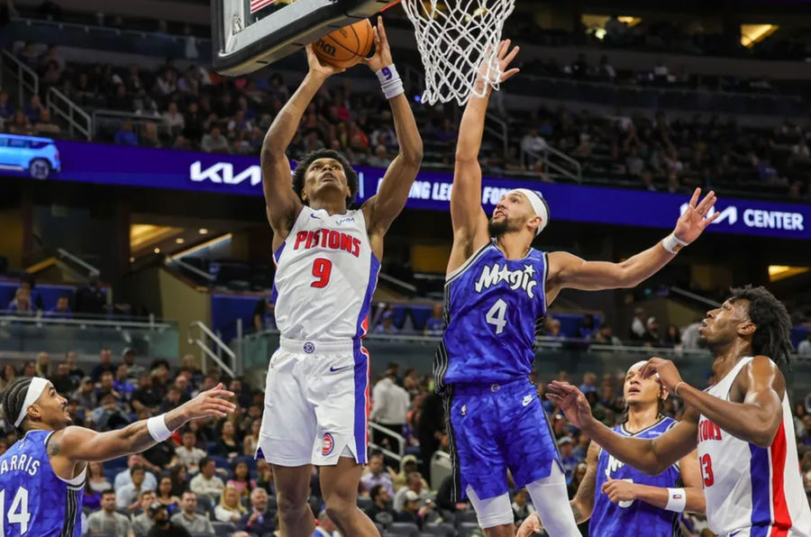 Mar 3, 2024; Orlando, Florida, USA; Detroit Pistons forward Ausar Thompson (9) goes to the basket against Orlando Magic guard Jalen Suggs (4) during the second half at KIA Center. Mandatory Credit: Mike Watters-Imagn Images