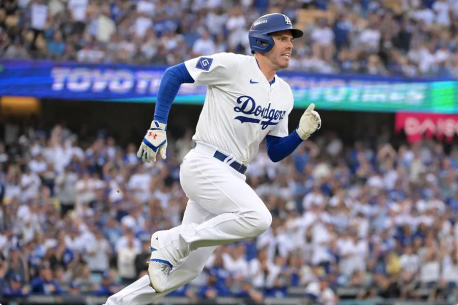 Oct 11, 2024; Los Angeles, California, USA; Los Angeles Dodgers first baseman Freddie Freeman (5) runs after hitting a single in the first inning during game five of the NLDS for the 2024 MLB Playoffs at Dodger Stadium. Mandatory Credit: Jayne Kamin-Oncea-Imagn Images