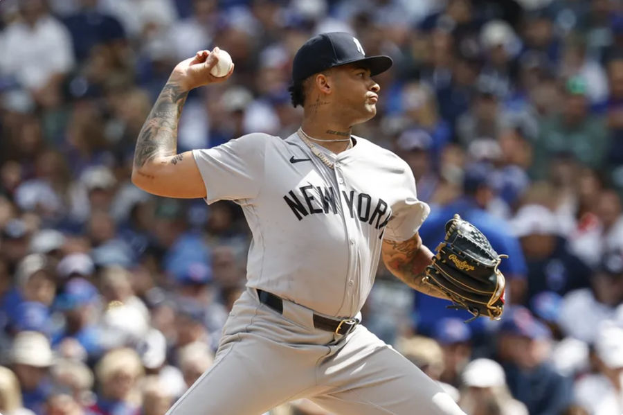 Sep 6, 2024; Chicago, Illinois, USA; New York Yankees starting pitcher Luis Gil (81) delivers a pitch against the Chicago Cubs during the first inning at Wrigley Field. Mandatory Credit: Kamil Krzaczynski-Imagn Images