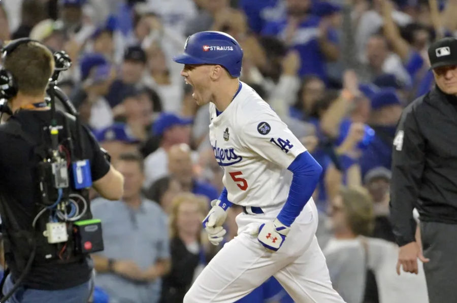 Oct 26, 2024; Los Angeles, California, USA; Los Angeles Dodgers first baseman Freddie Freeman (5) reacts after hitting a solo home run in the third inning against the New York Yankees during game two of the 2024 MLB World Series at Dodger Stadium. Mandatory Credit: Jayne Kamin-Oncea-Imagn Images