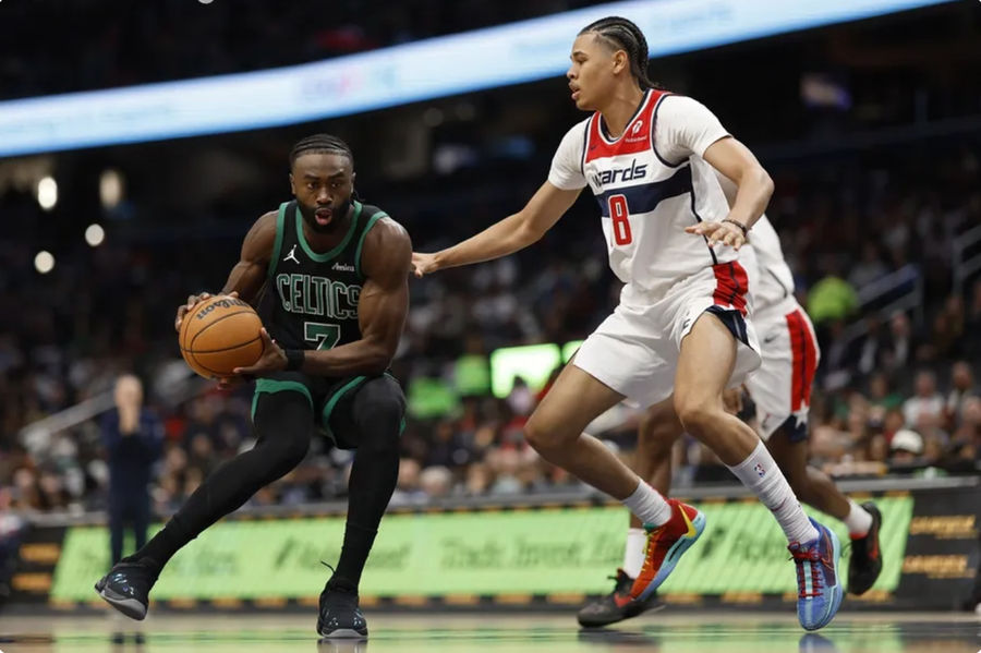 Oct 24, 2024; Washington, District of Columbia, USA; Boston Celtics guard Jaylen Brown (7) drives to the basket as Washington Wizards forward Kyshawn George (18) defends in the first half at Capital One Arena. Mandatory Credit: Geoff Burke-Imagn Images