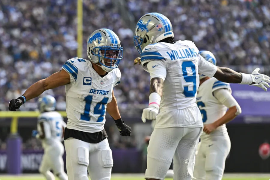 Oct 20, 2024; Minneapolis, Minnesota, USA; Detroit Lions wide receiver Amon-Ra St. Brown (14) reacts with wide receiver Jameson Williams (9) after catching a 35 yard touchdown pass from quarterback Jared Goff (not pictured) against the Minnesota Vikings the second quarter at U.S. Bank Stadium. Mandatory Credit: Jeffrey Becker-Imagn Images