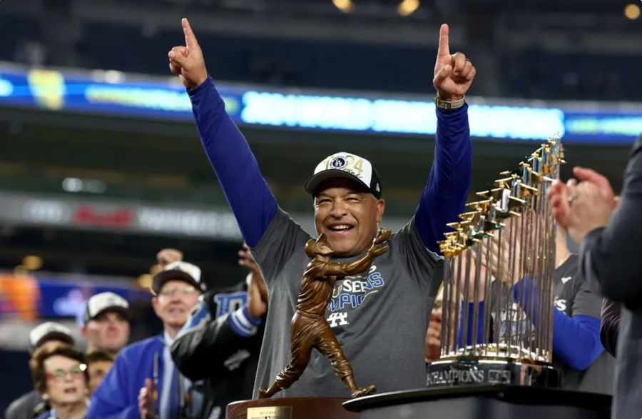 Oct 30, 2024; New York, New York, USA; Los Angeles Dodgers manager Dave Roberts (30) celebrates after winning the 2024 MLB World Series against the New York Yankees at Yankee Stadium. Mandatory Credit: Vincent Carchietta-Imagn Images