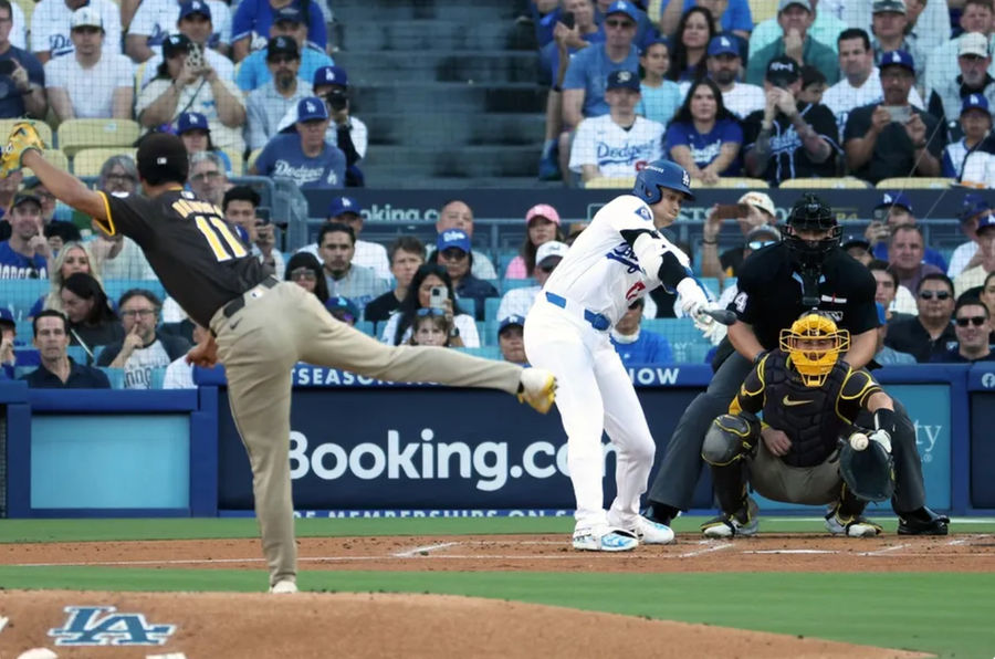 Oct 6, 2024; Los Angeles, California, USA; Los Angeles Dodgers designated hitter Shohei Ohtani (17) strikes out against San Diego Padres pitcher Yu Darvish (11) in the first inning during game two of the NLDS for the 2024 MLB Playoffs at Dodger Stadium. Mandatory Credit: Kiyoshi Mio-Imagn Images