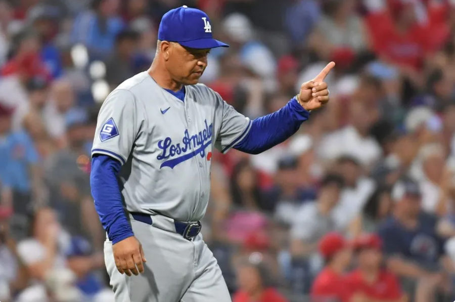 Jul 10, 2024; Philadelphia, Pennsylvania, USA; Los Angeles Dodgers manager Dave Roberts (30) signals to the bullpen to make a pitching change against the Philadelphia Phillies at Citizens Bank Park. Mandatory Credit: Eric Hartline-USA TODAY Sports