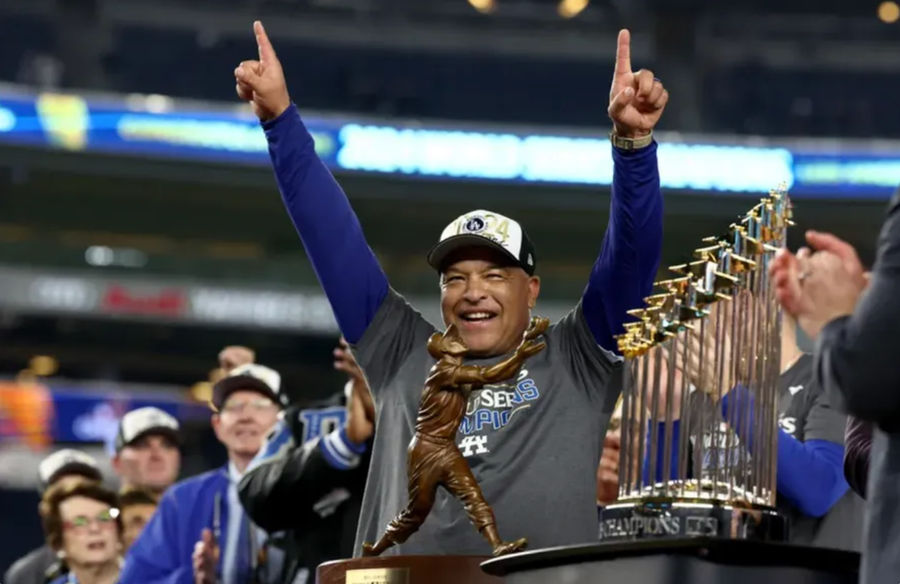 Oct 30, 2024; New York, New York, USA; Los Angeles Dodgers manager Dave Roberts (30) celebrates after winning the 2024 MLB World Series against the New York Yankees at Yankee Stadium. Mandatory Credit: Vincent Carchietta-Imagn Images