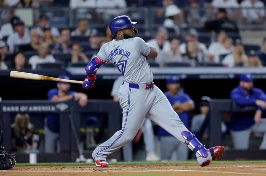 Aug 2, 2024; Bronx, New York, USA; Toronto Blue Jays first baseman Vladimir Guerrero Jr. (27) follows through on an RBI single against the New York Yankees during the first inning at Yankee Stadium. Mandatory Credit: Brad Penner-USA TODAY Sports