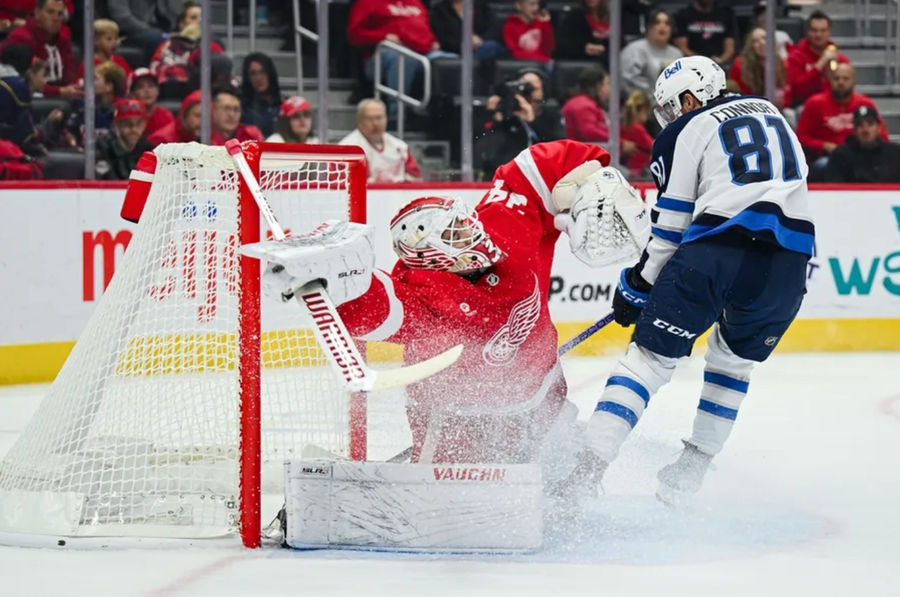 Oct 30, 2024; Detroit, Michigan, USA; Winnipeg Jets left wing Kyle Connor (81) scores a goal as Detroit Red Wings goaltender Alex Lyon (34) tends the net during the first period at Little Caesars Arena. Mandatory Credit: Tim Fuller-Imagn Images