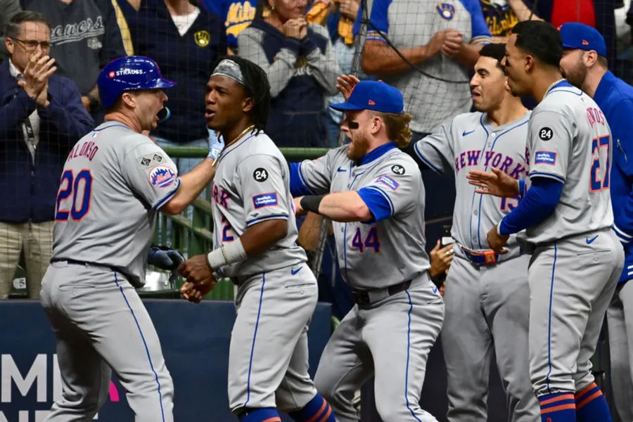 Oct 3, 2024; Milwaukee, Wisconsin, USA; New York Mets first baseman Pete Alonso (20) celebrates with teammates after hitting a three run home run against the Milwaukee Brewers in the ninth inning during game three of the Wildcard round for the 2024 MLB Playoffs at American Family Field. Mandatory Credit: Benny Sieu-Imagn Images