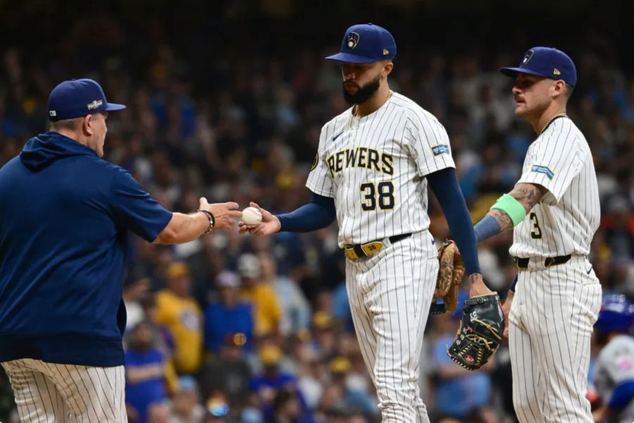 Oct 3, 2024; Milwaukee, Wisconsin, USA; Milwaukee Brewers pitcher Devin Williams (38) is relieved in the ninth inning against the New York Mets during game three of the Wildcard round for the 2024 MLB Playoffs at American Family Field. Mandatory Credit: Benny Sieu-Imagn Images