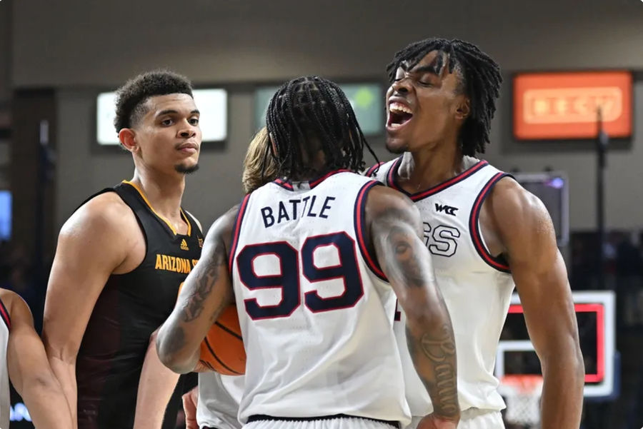 Nov 10, 2024; Spokane, Washington, USA; Gonzaga Bulldogs guard Khalif Battle (99) and Gonzaga Bulldogs guard Michael Ajayi (1) begin to celebrate after a game against the Arizona State Sun Devils at McCarthey Athletic Center. Gonzaga Bulldogs won 88-80. Mandatory Credit: James Snook-Imagn Images