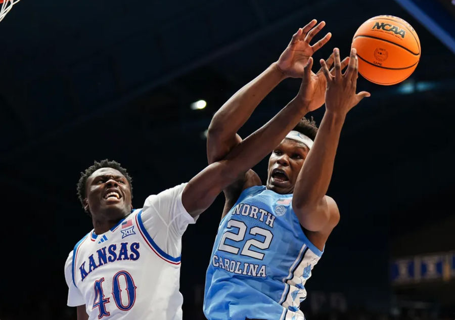 Nov 8, 2024; Lawrence, Kansas, USA; Kansas Jayhawks forward Flory Bidunga (40) and North Carolina Tar Heels forward Ven-Allen Lubin (22) fight for a rebound during the first half at Allen Fieldhouse. Mandatory Credit: Jay Biggerstaff-Imagn Images