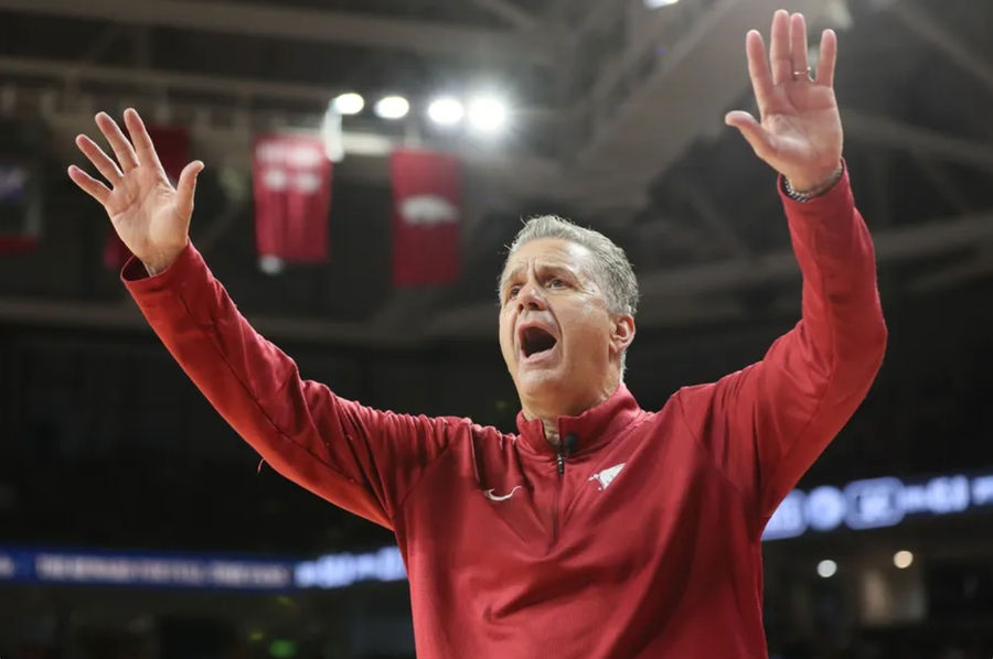 Oct 25, 2024; Fayetteville, AR, USA; Arkansas Razorbacks head coach John Calipari quiets the crowd as they began chanting “overrated” late in the second half against the Kansas Jayhawks at Bud Walton Arena. Mandatory Credit: Nelson Chenault-Imagn Images