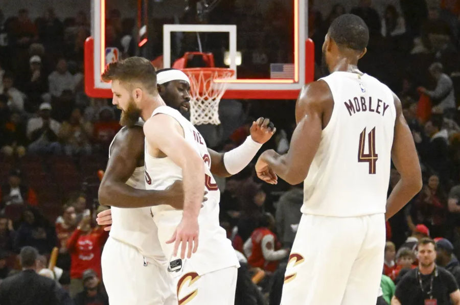 11 Nov 2024; Chicago, Illinois, USA; Cleveland Cavaliers guard Caris LeVert (3) hugs forward Dean Wade (32) and forward Evan Mobley (4) after the game against the Chicago Bulls at the United Center. Mandatory Credits: Image Matt Marton-Imagn