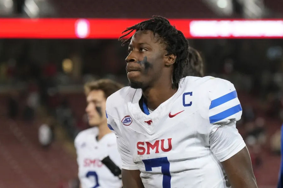 Oct 19, 2024; Stanford, California, USA; Southern Methodist Mustangs quarterback Kevin Jennings (7) walks off of the field after defeating the Stanford Cardinal at Stanford Stadium. Mandatory Credit: Darren Yamashita-Imagn Images