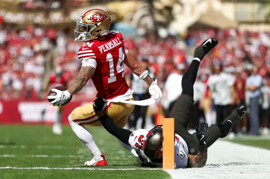 Nov 10, 2024; Tampa, Florida, USA; San Francisco 49ers wide receiver Ricky Pearsall (14) score a touchdown past Tampa Bay Buccaneers safety Antoine Winfield Jr. (31) in the first quarter at Raymond James Stadium. Mandatory Credit: Nathan Ray Seebeck-Imagn Images