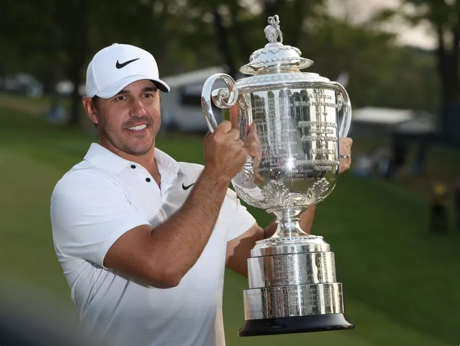 Brooks Koepka poses with the Wanamaker Trophy on the 18th green following his victory at the PGA Championship at Oak Hill Country Club Sunday, May 21, 2023. PHOTO USA TODAY SPORTS IMAGES.