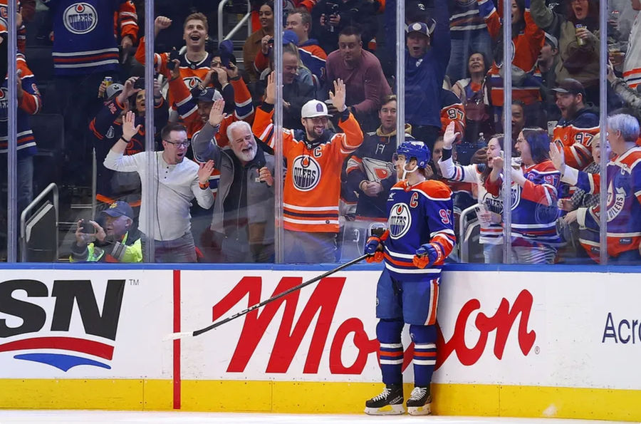 Nov 14, 2024; Edmonton, Alberta, CAN; Edmonton Oilers forward Connor McDavid (97) celebrates after scoring a goal during the second period, his 1000th NHL point against the Nashville Predators at Rogers Place. Mandatory Credit: Perry Nelson-Imagn Images