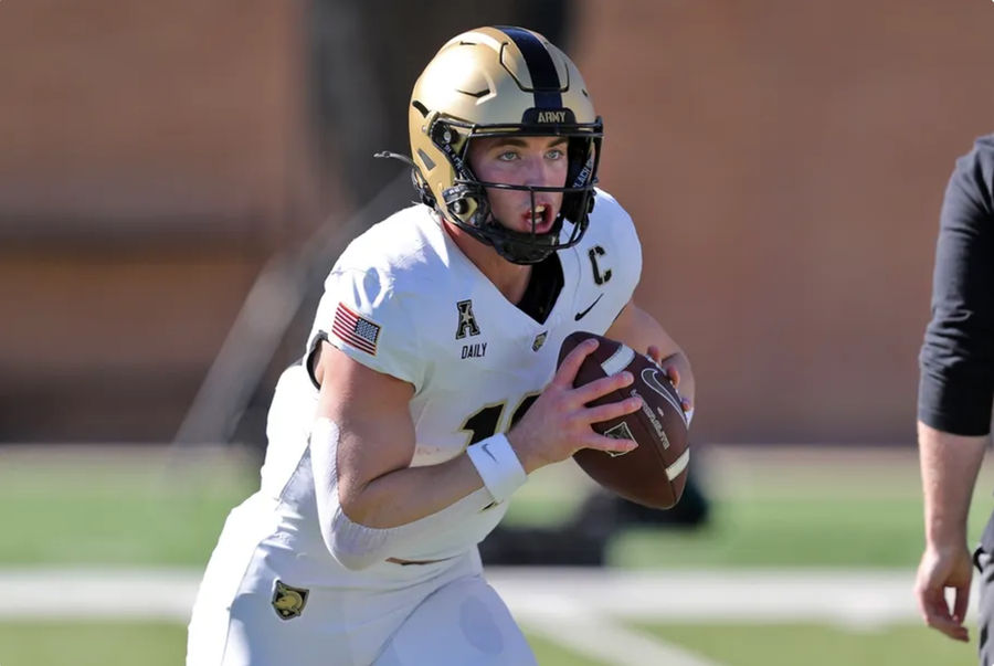 Nov 9, 2024; Denton, Texas, USA; Army Black Knights quarterback Bryson Daily (13) carries the ball during warmups before a game against the North Texas Mean Green at DATCU Stadium. Mandatory Credit: Danny Wild-Imagn Images