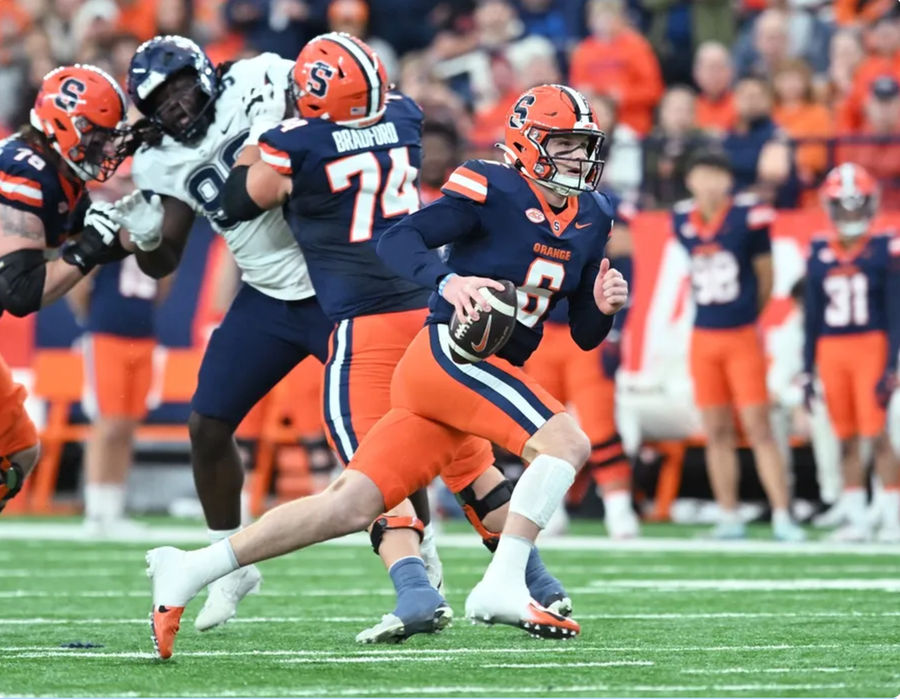 Nov 23, 2024; Syracuse, New York, USA; Syracuse Orange quarterback Kyle McCord (6) runs out of the pocket in the first quarter against the Connecticut Huskies at the JMA Wireless Dome. Mandatory Credit: Mark Konezny-Imagn Images