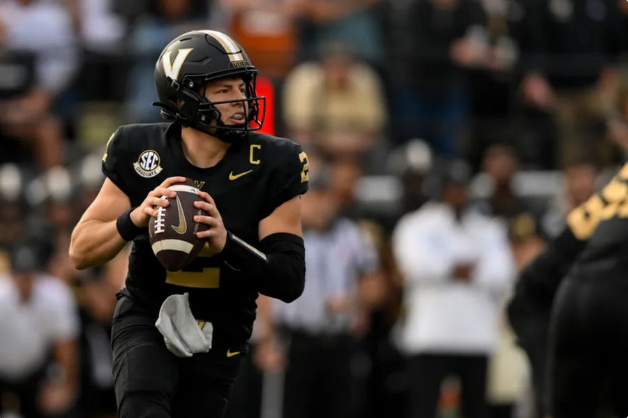 Oct 26, 2024; Nashville, Tennessee, USA; Vanderbilt Commodores quarterback Diego Pavia (2) scrambles against the Texas Longhorns during the first half at FirstBank Stadium. Mandatory Credit: Steve Roberts-Imagn Images