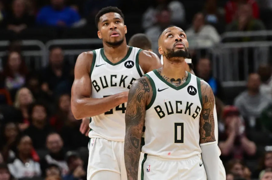 Oct 14, 2024; Milwaukee, Wisconsin, USA; Milwaukee Bucks forward Giannis Antetokounmpo (34) and guard Damian Lillard (0) look on in the second quarter against the Chicago Bulls at Fiserv Forum. Mandatory Credit: Benny Sieu-Imagn Images