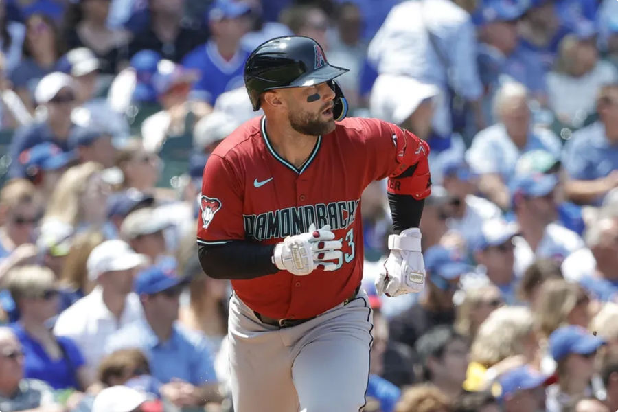 Jul 19, 2024; Chicago, Illinois, USA; Arizona Diamondbacks first baseman Christian Walker (53) watches his two-run single against the Chicago Cubs during the third inning at Wrigley Field. Mandatory Credit: Kamil Krzaczynski-USA TODAY Sports