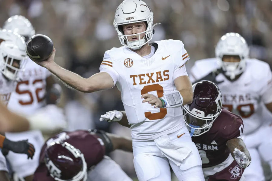 Nov 30, 2024; College Station, Texas, USA; Texas Longhorns quarterback Quinn Ewers (3) attempts a pass as Texas A&M Aggies linebacker Scooby Williams (0) applies defensive pressure during the first quarter at Kyle Field. Mandatory Credit: Troy Taormina-Imagn Images