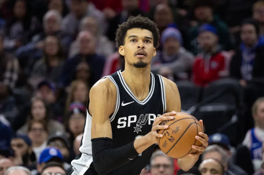 Dec 23, 2024; Philadelphia, Pennsylvania, USA; San Antonio Spurs center Victor Wembanyama (1) shoots the ball against the Philadelphia 76ers during the fourth quarter at Wells Fargo Center. Mandatory Credit: Bill Streicher-Imagn Images