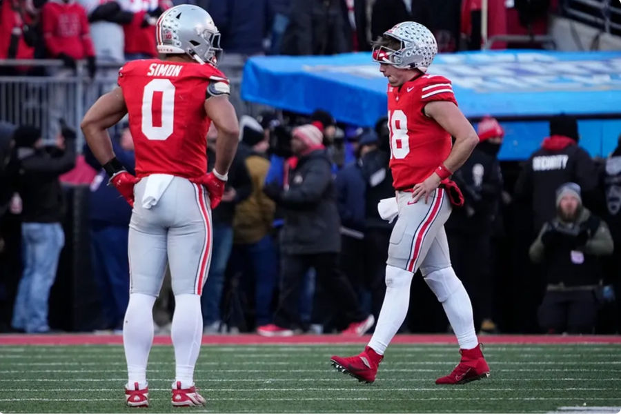 Ohio State Buckeyes quarterback Will Howard (18) and linebacker Cody Simon (0) walk off the field during the second half of the NCAA football game against the Michigan Wolverines at Ohio Stadium in Columbus on Saturday, Nov. 30, 2024. Michigan won 13-10. PHOTO USA TODAY SPORTS IMAGES.