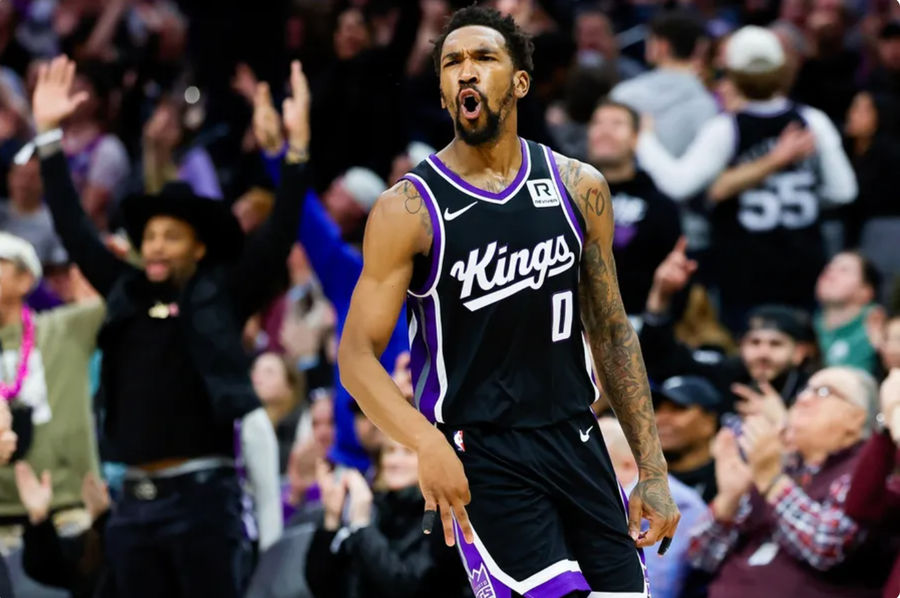 Jan 3, 2025; Sacramento, California, USA; Sacramento Kings guard Malik Monk (0) celebrates after scoring a basket during the fourth quarter against the Memphis Grizzlies at Golden 1 Center. Mandatory Credit: Sergio Estrada-Imagn Images