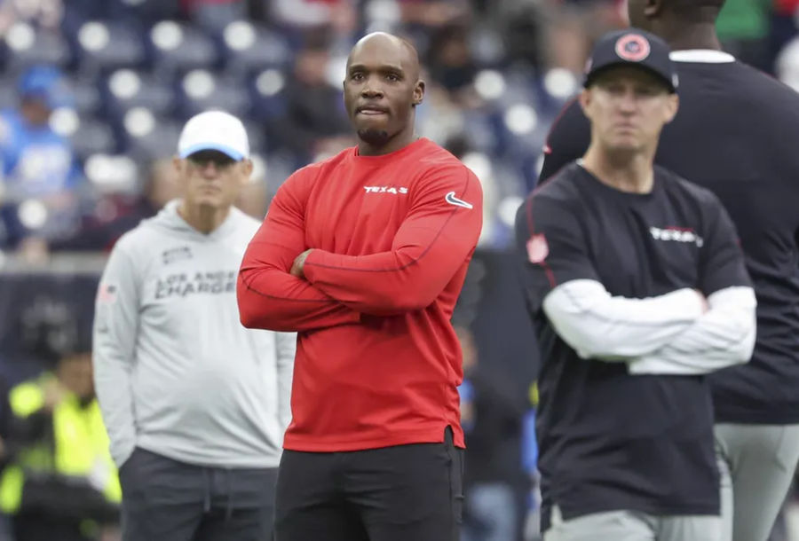 Jan 11, 2025; Houston, Texas, USA; Houston Texans head coach DeMeco Ryans and offensive coordinator Bobby Slowik look on from the field before the game against the Los Angeles Chargers in an AFC wild card game at NRG Stadium. Mandatory Credit: Troy Taormina-Imagn Images