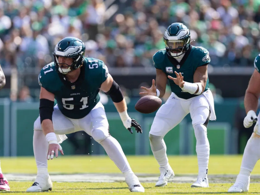 Oct 13, 2024; Philadelphia, Pennsylvania, USA; Philadelphia Eagles center Cam Jurgens (51) snaps the ball to quarterback Jalen Hurts (1) in a game against the Cleveland Browns at Lincoln Financial Field. Mandatory Credit: Bill Streicher-Imagn Images