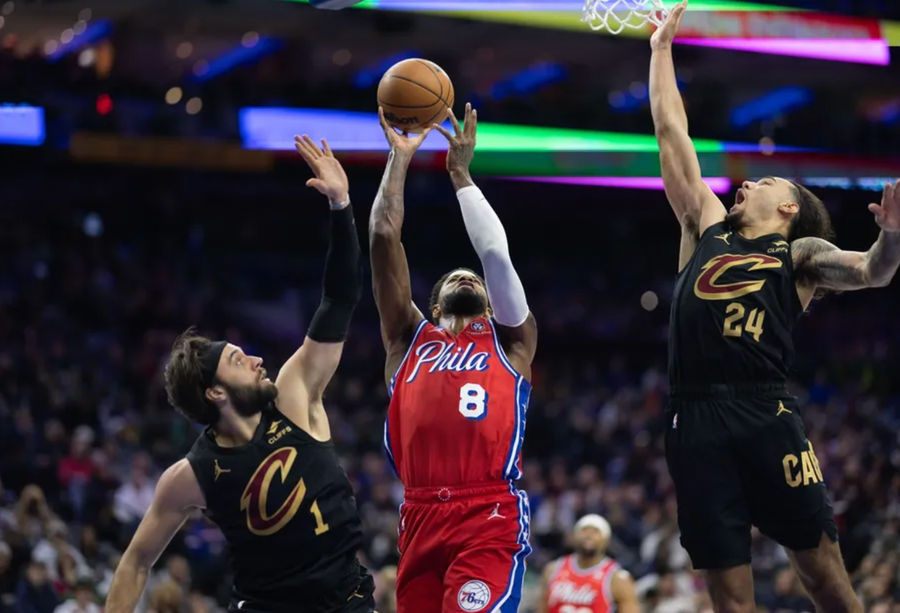 Jan 24, 2025; Philadelphia, Pennsylvania, USA; Philadelphia 76ers forward Paul George (8) drives for a shot against Cleveland Cavaliers guard Max Strus (1) and forward Jaylon Tyson (24) during the second quarter at Wells Fargo Center. Mandatory Credit: Bill Streicher-Imagn Images